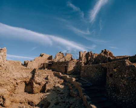 Photo for Ancient stone ruins of the Oracle Temple under a blue sky, Siwa Oasis, Egypt - Royalty Free Image