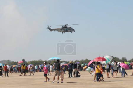 Téléchargez les photos : NAKHON PATHOM, THAILAND - January 14, 2023 : Air Show Eurocopter EC725 Caracal, The helicopter  for troop transport, casualty evacuation, and combat search and rescue duties in national children day. - en image libre de droit