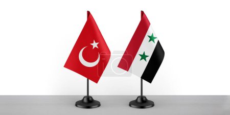 Image of the table flag of Turkey and Syria countries. White background, close-up flags.