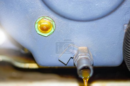 about the oil level gauge at the gearbox and oil leaking from the drain hole