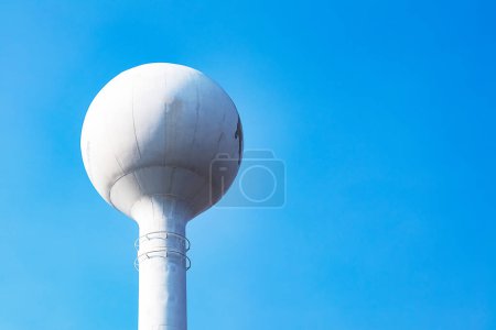 High tower water tank in power plant and blue sky