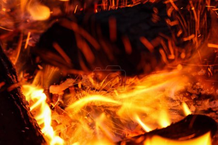 Close-up Of Embers With Flames Burning In Wood Fire