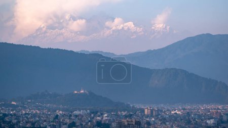 Photo for A view of the Swayambhunath Temple and the Himalaya Mountains in the background in the evening light. - Royalty Free Image