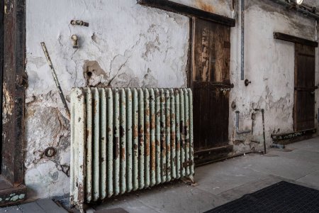 A radiator and the wooden cell doors of the Eastern State Penitentionry of Philadelphia.