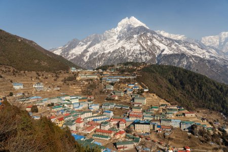 A High Angle View of Namche Bazaar in the valley with mountains all around.