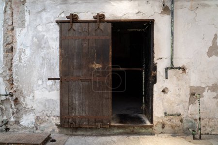A wooden rolling door to a cell in the Eastern State Penitentionry of Philadelphia.