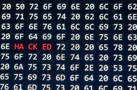 A close-up image displaying a screen filled with hexadecimal values where the word 'HACKED' sharply stands out in red, symbolizing a security breach.