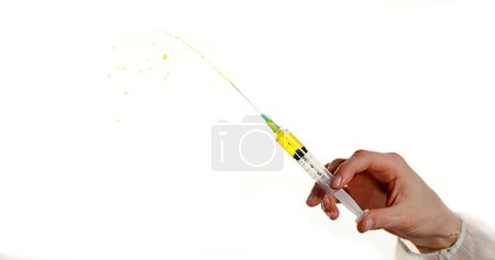 Photo for Liquid squirting from Needle against White Background - Royalty Free Image