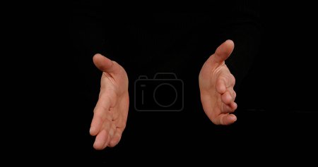 Photo for Hands of Woman Clapping against Black Background - Royalty Free Image