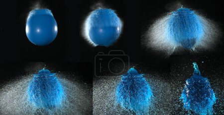 Foto de Disparo de romper el agua llena globo azul - Imagen libre de derechos
