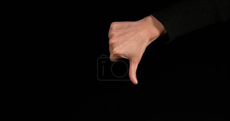 Photo for Hand of Woman making Sign against Black Background - Royalty Free Image