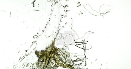 Photo for Glass of White Wine Breaking and Splashing against White Background - Royalty Free Image