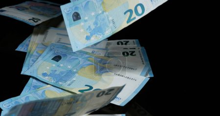 Photo for Euros Money Falling against Black Background - Royalty Free Image