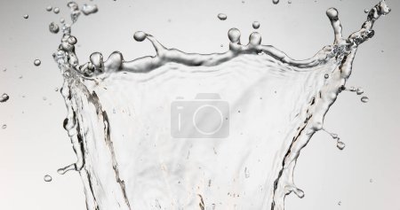 Photo for Water Spurting out against White Background - Royalty Free Image