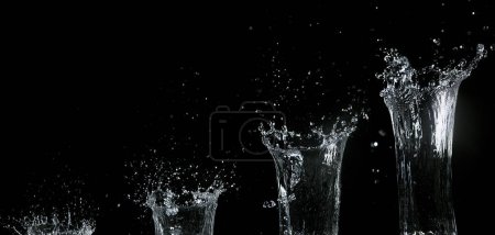 Photo for Water spurting out against Black Background - Royalty Free Image