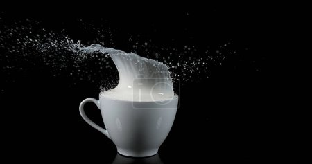 Photo for Bowl with Exploding Milk against Black Background - Royalty Free Image