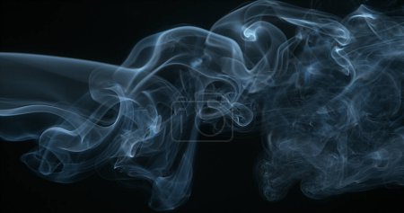 Photo for Smoke of Cigarette rising against Black Background - Royalty Free Image