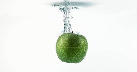 Photo for Granny Smith Apples, malus domestica, Fruits entering Water against White Background - Royalty Free Image