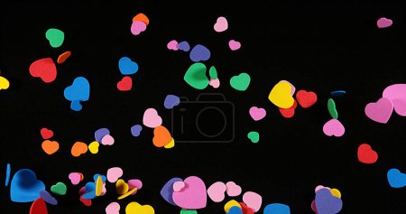 Photo for Hearts falling against Black Background for Saint Valentine's Day - Royalty Free Image