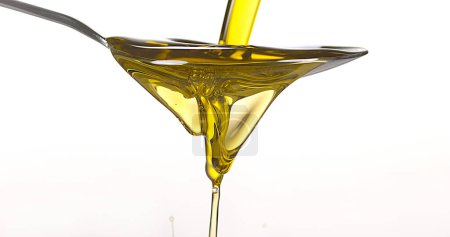 Photo for Olive Falling into Olive Oil against White Background - Royalty Free Image