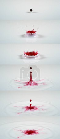 Foto de Tinta roja cayendo en líquido contra fondo blanco. - Imagen libre de derechos