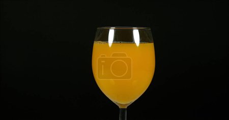 Photo for Glass of Orange against Black Background - Royalty Free Image