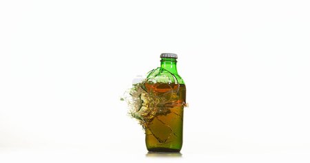 Photo for Bottle of Beer Breaking and Splashing against White Background - Royalty Free Image