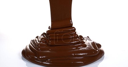 Photo for Chocolate Flowing on White Background - Royalty Free Image