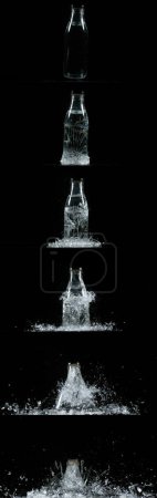Foto de Botella cayendo y explotando sobre fondo negro - Imagen libre de derechos