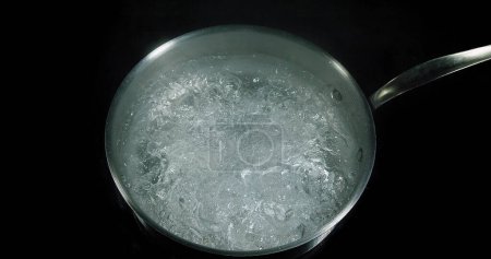 Photo for Hot Boiling Water in a saucepan - Royalty Free Image