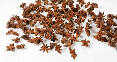 Photo for Star Anise illicium verum,, spice falling against White Background - Royalty Free Image