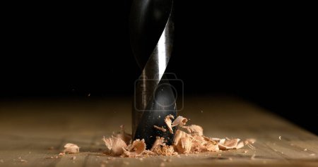 Photo for Wood Chip Turning on a Wood Board, Making Chips - Royalty Free Image