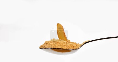Photo for Ginger, Zingiber officinale, Root and Powder against White Background - Royalty Free Image