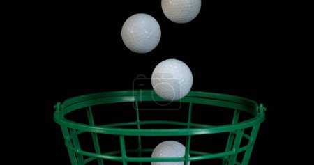 Photo for Golf's Balls falling against Black background - Royalty Free Image