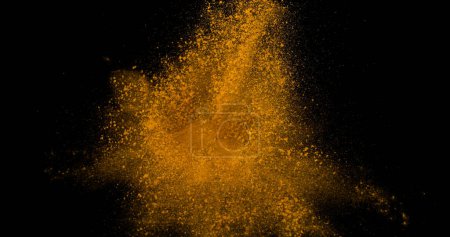 Photo for Curry Powder falling against Black Background - Royalty Free Image