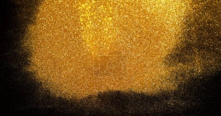 Photo for Gold Glitter Falling on Black Background - Royalty Free Image