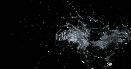 Photo for Water Exploding and Splashing against Black Background - Royalty Free Image