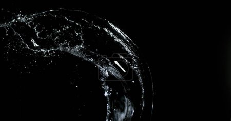 Photo for Water spurting out ans Splashing against Black Background - Royalty Free Image