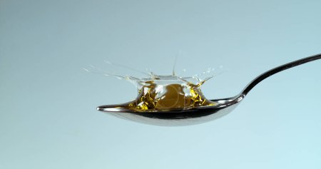 Photo for Green Olives, Olea europaea, Falling in a Spoon - Royalty Free Image