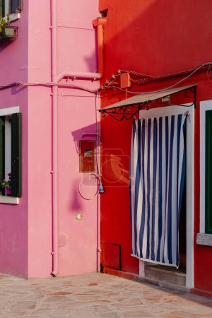 Colorful facade with striped curtain door