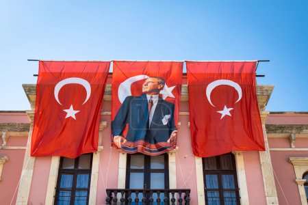 Photo for Edirne, Turkey - August 2022 : Mustafa Kemal Ataturk portrait and Turkish flag at government building in Turkey. - Royalty Free Image