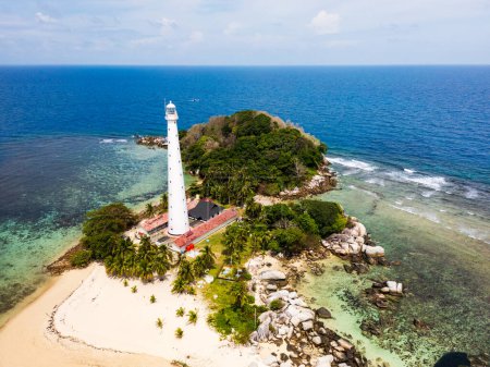 Belitung beach and islands drone view with Lengkuas Island lighthouse. Beautiful aerial view of islands, boat, sea and rocks in Belitung, Indonesia 
