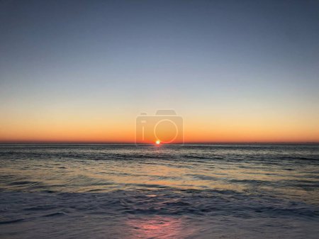 Sunset on the ocean. Portugal, Santa Cruz beach.