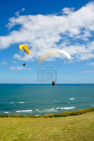 Photo for Paragliders flying over the sea in the city of Torres in the state of Rio Grande do Sul - Royalty Free Image