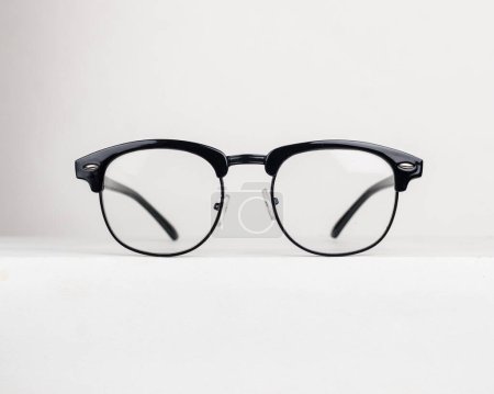 Timeless clubmaster eyeglasses on white background. Rounded profile clubmaster eyeglasses and metal rims glasses frame