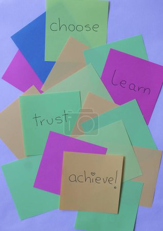Bright post-its with positive messages about personal effort, including the words: choose, learn, trust, achieve