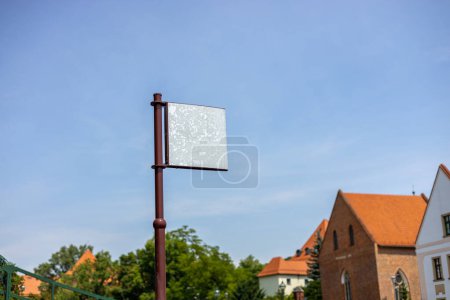 Information or advertisement blank sign board mounted in urban park outdoor.