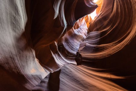 Upper Antelope Canyon, near Page, Arizona, is a breathtaking slot canyon known for its narrow passageways and vibrant sandstone walls.