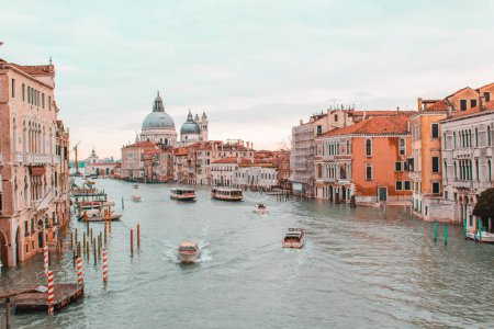 A group of people in a harbor with Grand Canal in the background. High quality photo