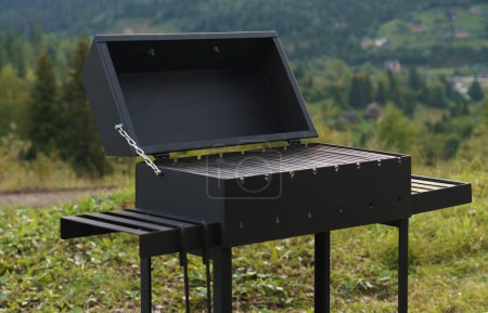 Photo for Modern barbeque grill with mountain view - Royalty Free Image